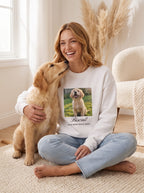 Woman in a white custom photo sweatshirt printed with her golden retriever and his name, hugging the real dog