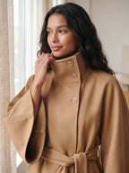 Close-up of the City Muse cape coat high funnel collar with button detail in camel