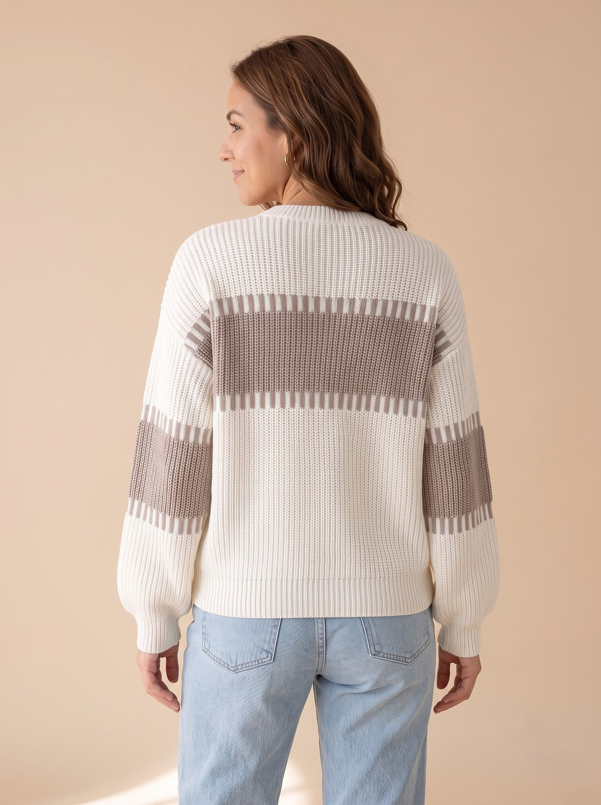 Back view of the Latte Days cream and taupe rib knit sweater with the taupe band across the upper back