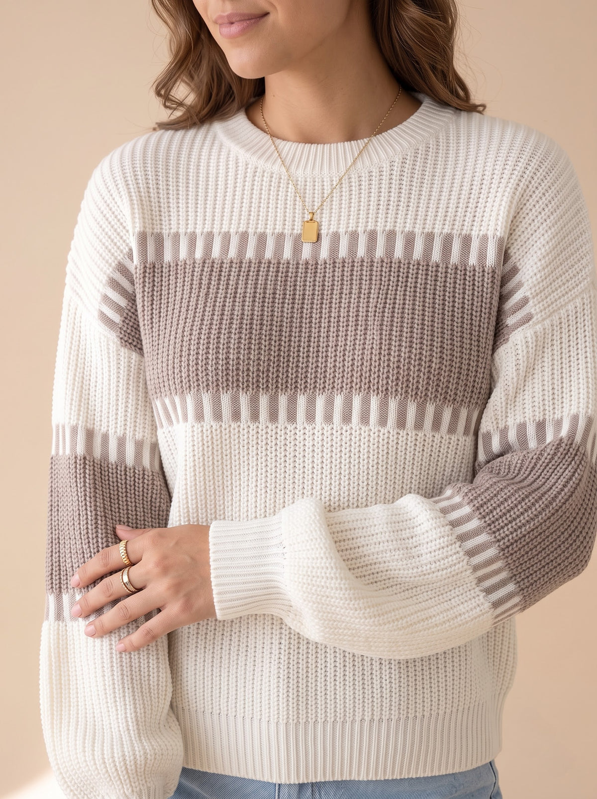 Close-up of the chunky rib knit, crew neckline and dashed taupe band edging on the Latte Days sweater