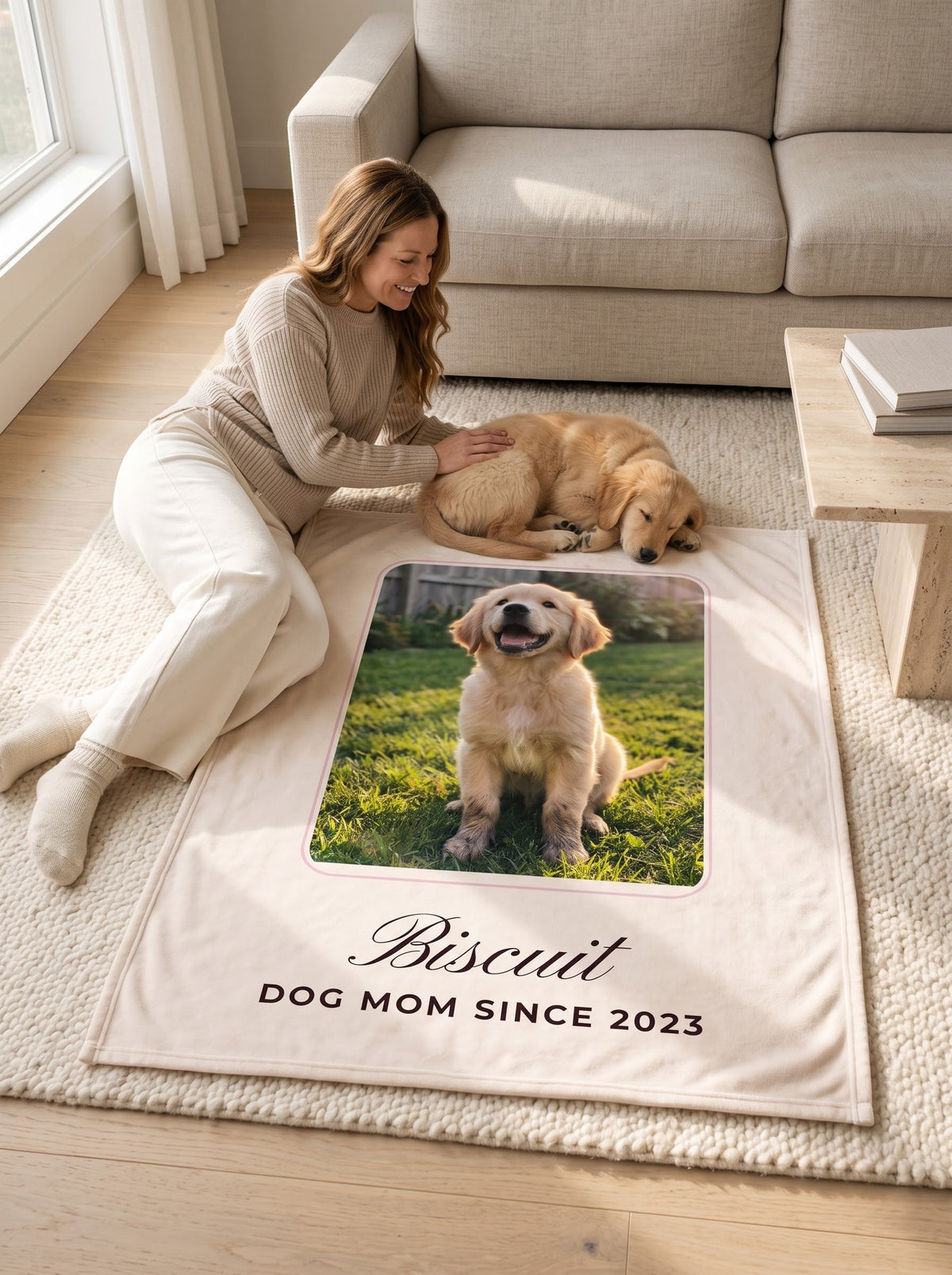 Mom and golden retriever puppy relaxing on a custom pet photo blanket on the living room rug