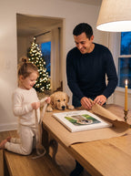 Dad and daughter wrapping a custom dog photo canvas on Christmas Eve