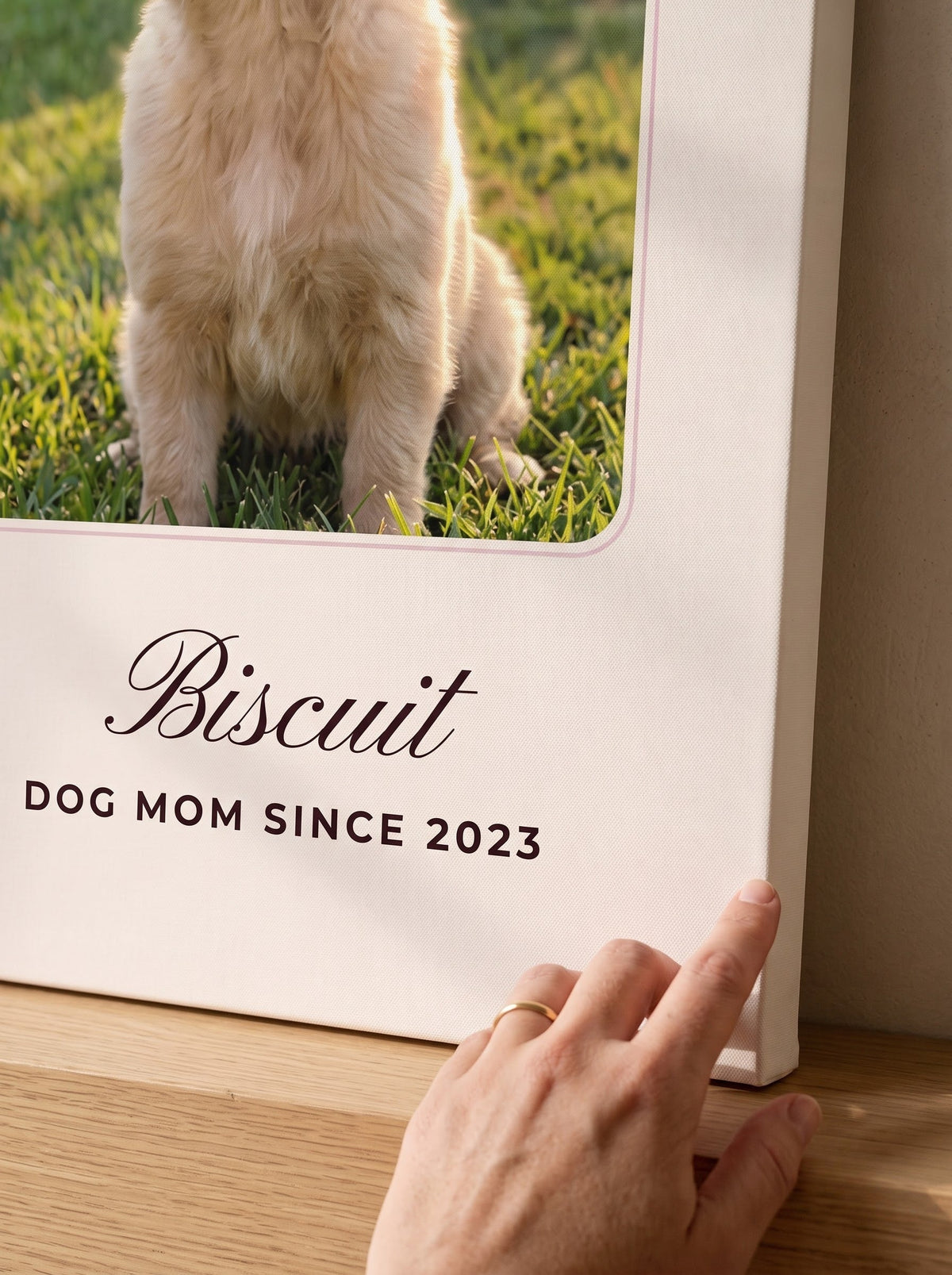 Close-up of the canvas weave and printed name on a personalized pet portrait