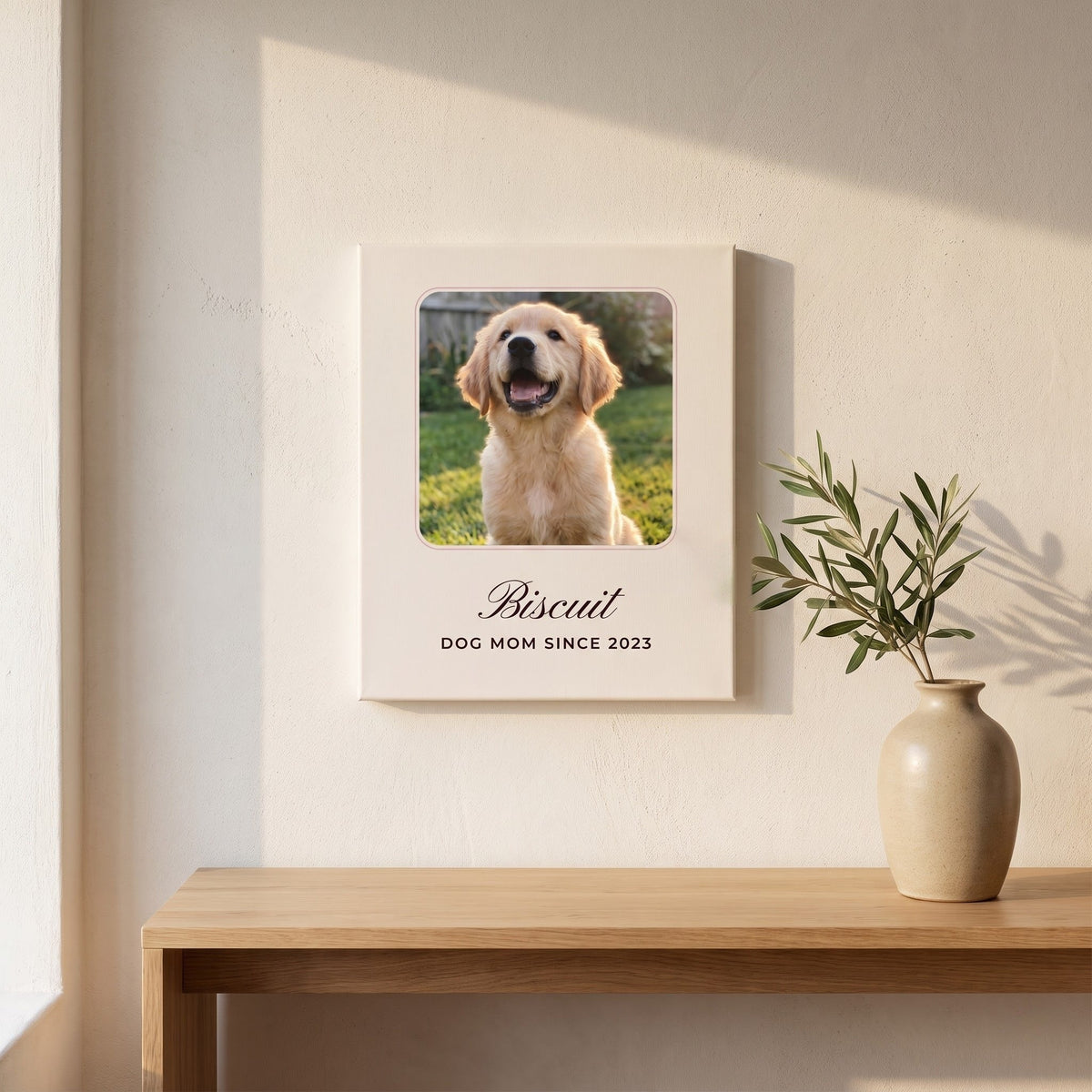 Custom golden retriever photo canvas hanging above an oak console