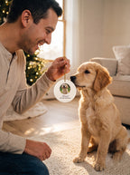 Dad showing a golden retriever puppy his own custom photo ornament