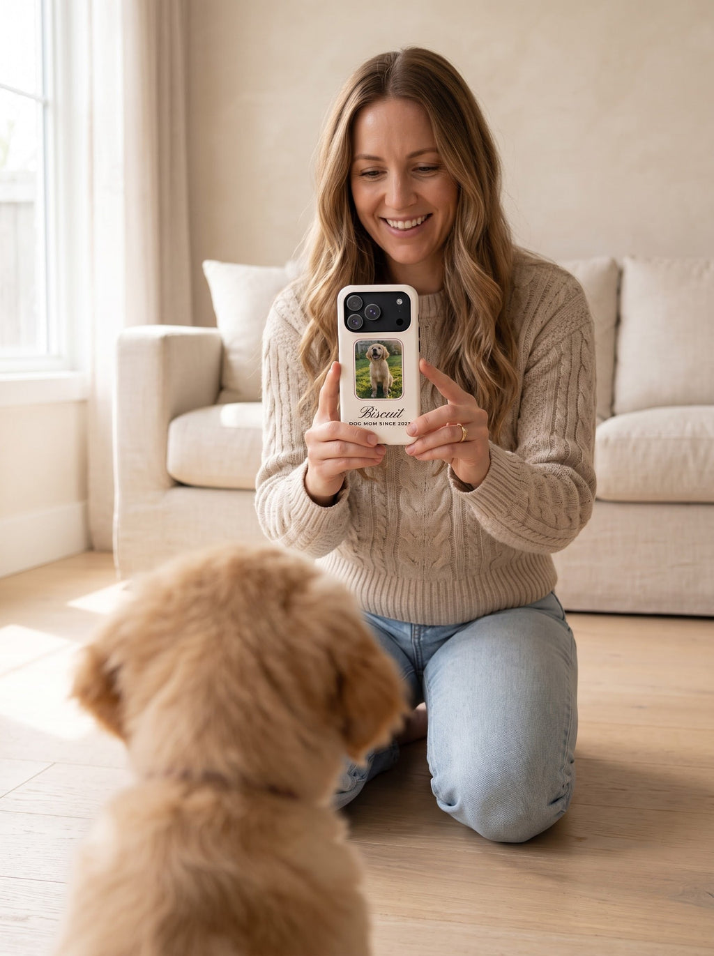 Woman photographing her golden retriever puppy with her custom pet photo phone case