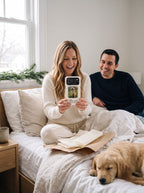 Couple opening a personalized dog photo phone case on Christmas morning in bed
