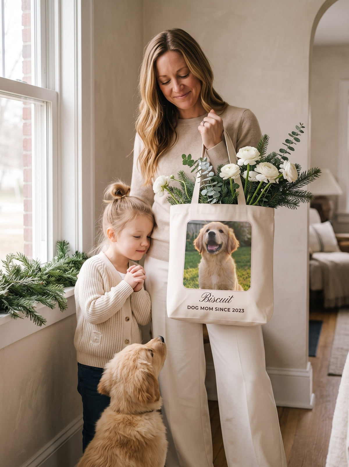 Mom carrying winter flowers in a personalized pet photo tote with her daughter and puppy