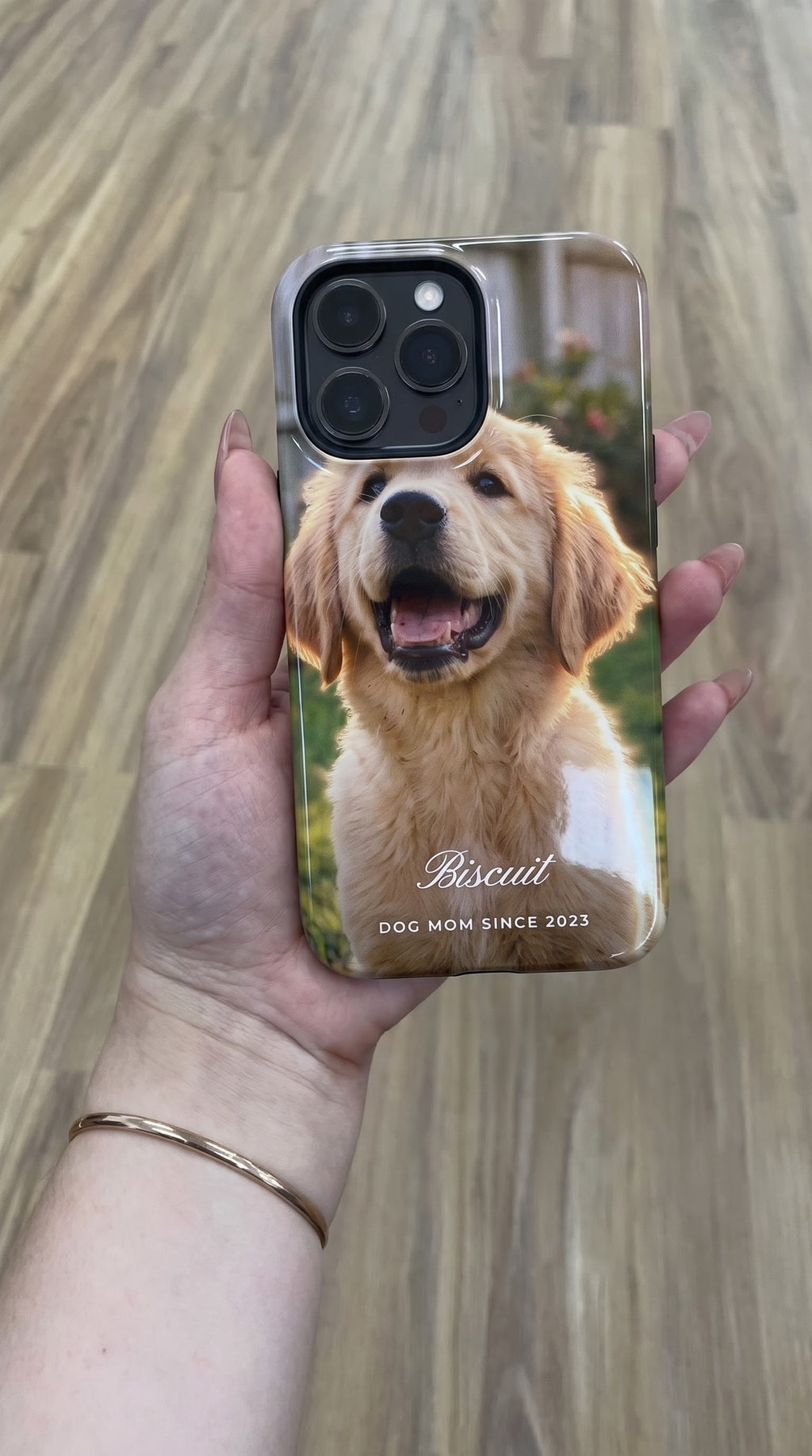 Full photo case: puppy photo printed edge to edge with the name Biscuit, held flat in hand