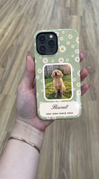 Sage daisy full-wrap case with a puppy photo window, held in hand