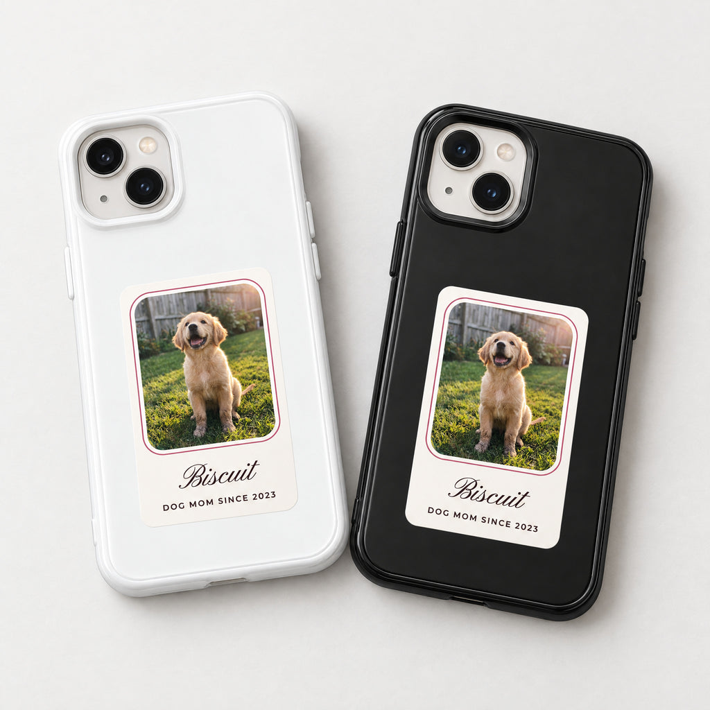White and black HoloFrame cases side by side, each with a printed puppy photo card