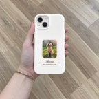 White HoloFrame case with a printed puppy photo card, held in hand