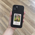 Black HoloFrame case with a printed puppy photo card, held in hand