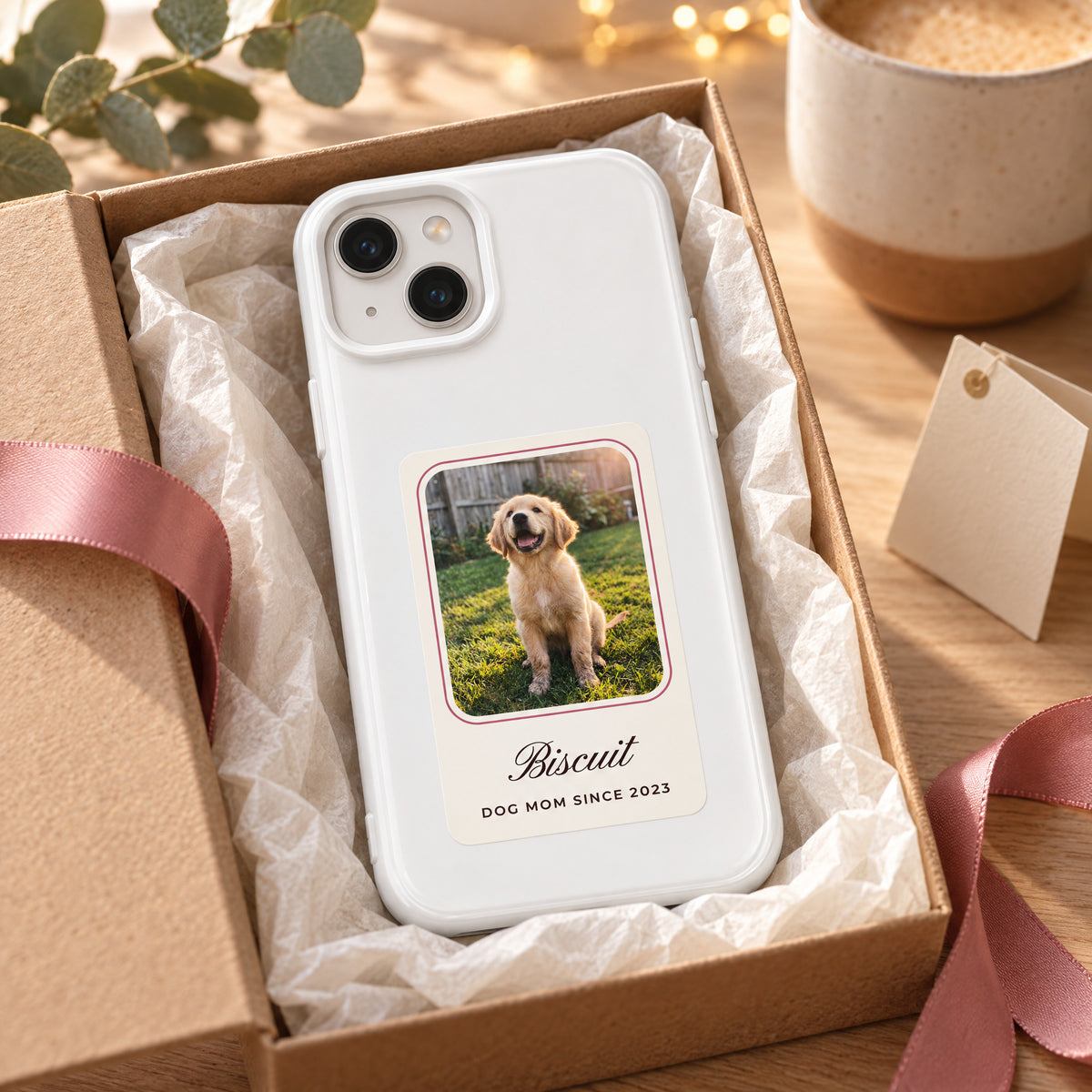 White HoloFrame photo case in a gift box with tissue paper and ribbon