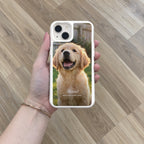 White HoloFrame case with a full-back puppy photo print, held in hand